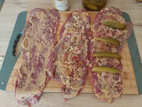 Beef rolls in different stages of filling